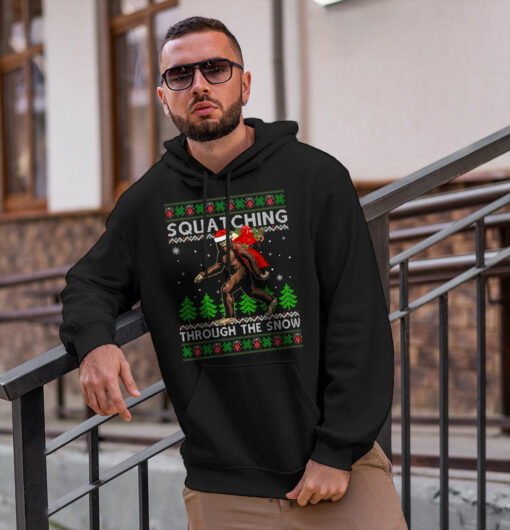 2020-11-Men-Hoodie-Bigfoot-Squatching-Through-The-Snow-Christmas-mockup2-black.jpg